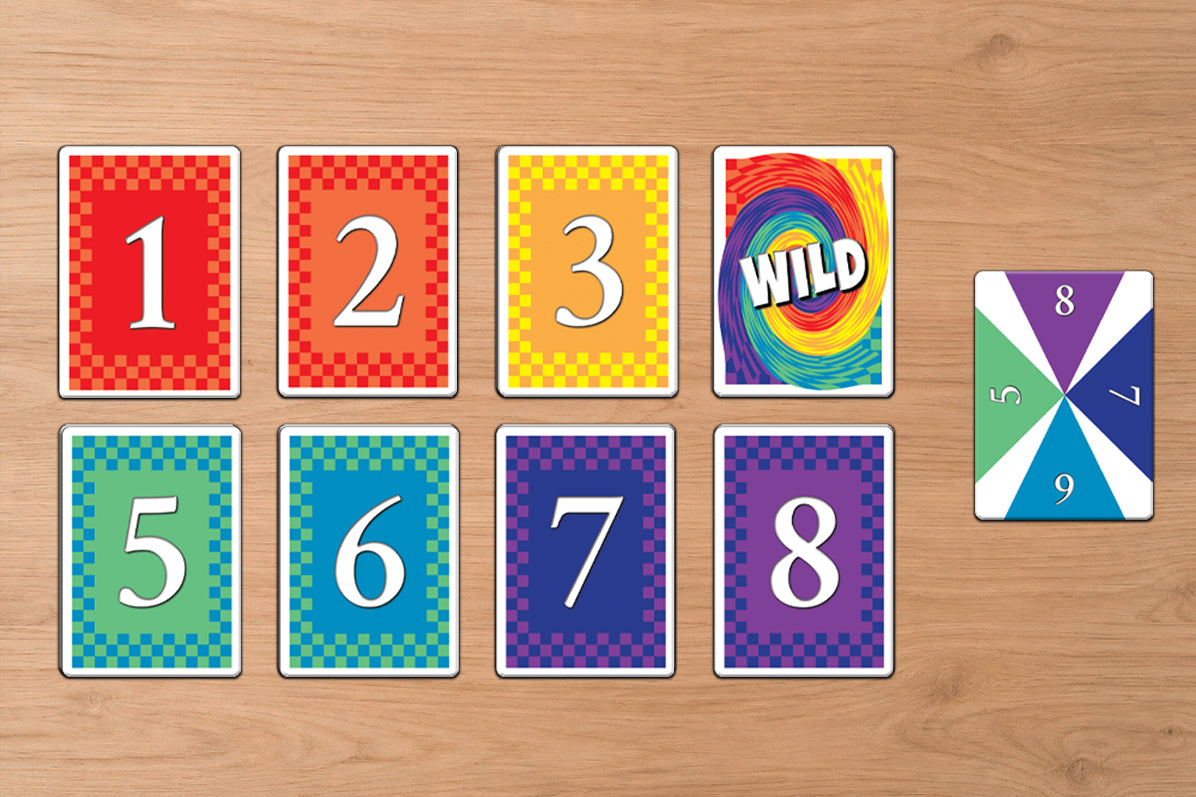 Colorful card game cards with numbers and a 'Wild' card on a wooden surface